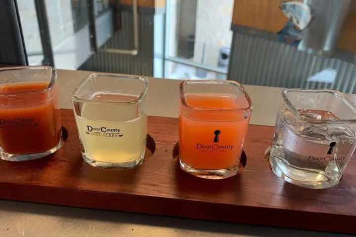 a glass of orange juice next to a cup of coffee