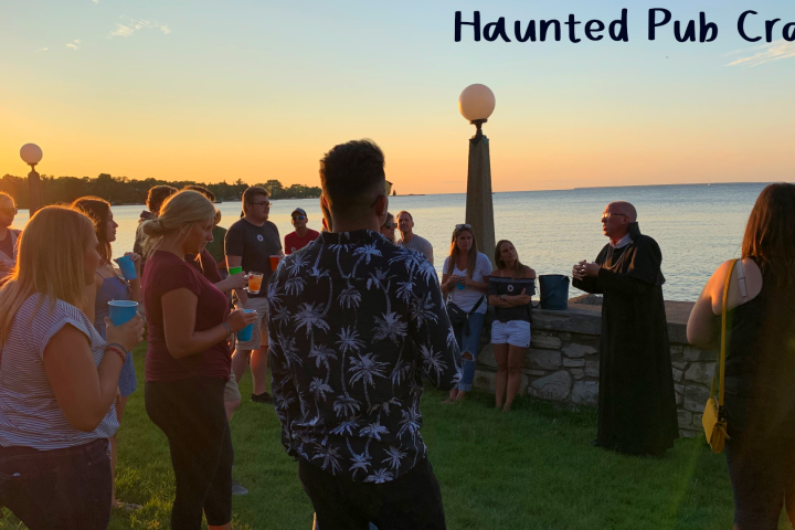 a group of people standing in front of water