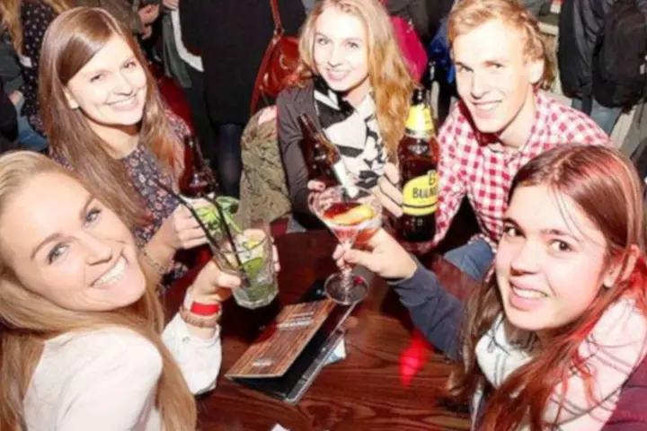 a group of people sitting at a table