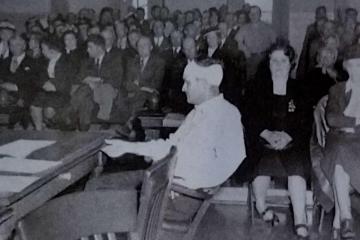 a group of people standing in front of a crowd