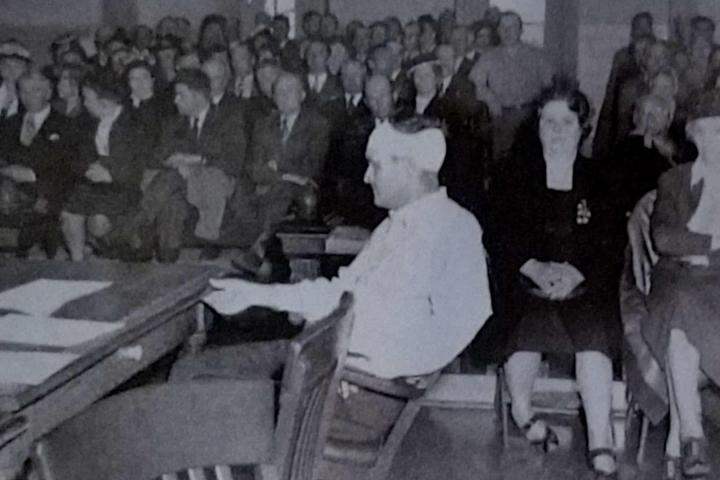 a group of people standing in front of a crowd