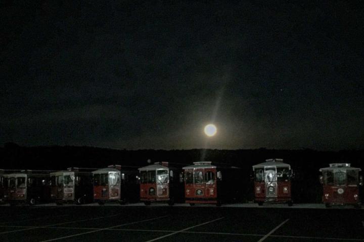 a group of people sitting at night