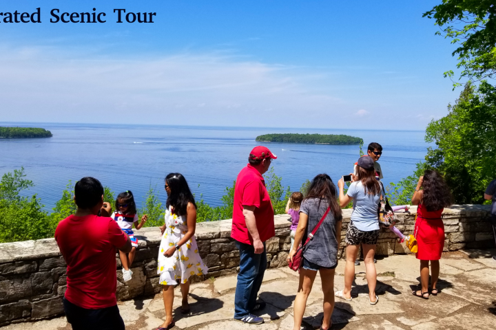 a group of people standing next to a body of water