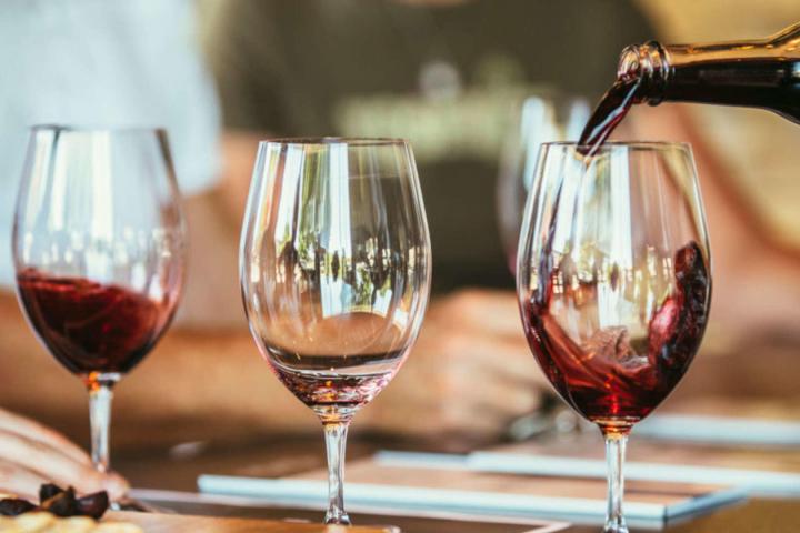 a close up of a glass of red wine