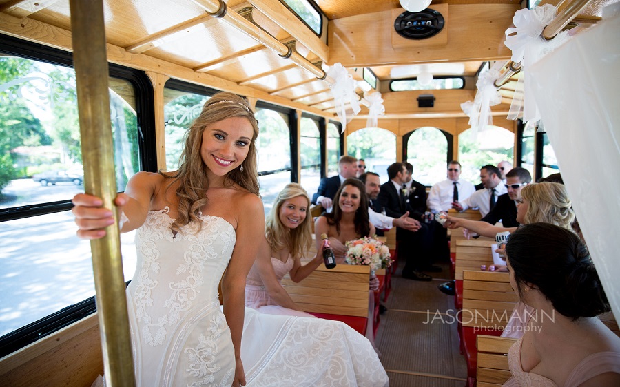 Ashley Lobo standing in front of a window