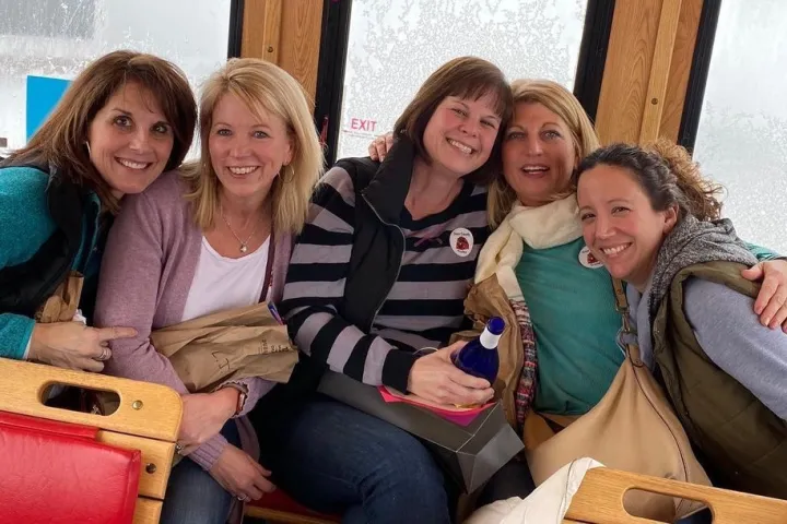 a group of people sitting posing for the camera